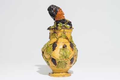 An exceptional Flemish pottery figurative tobacco jar, attr. to Leo Maes, 2nd half 19th C.